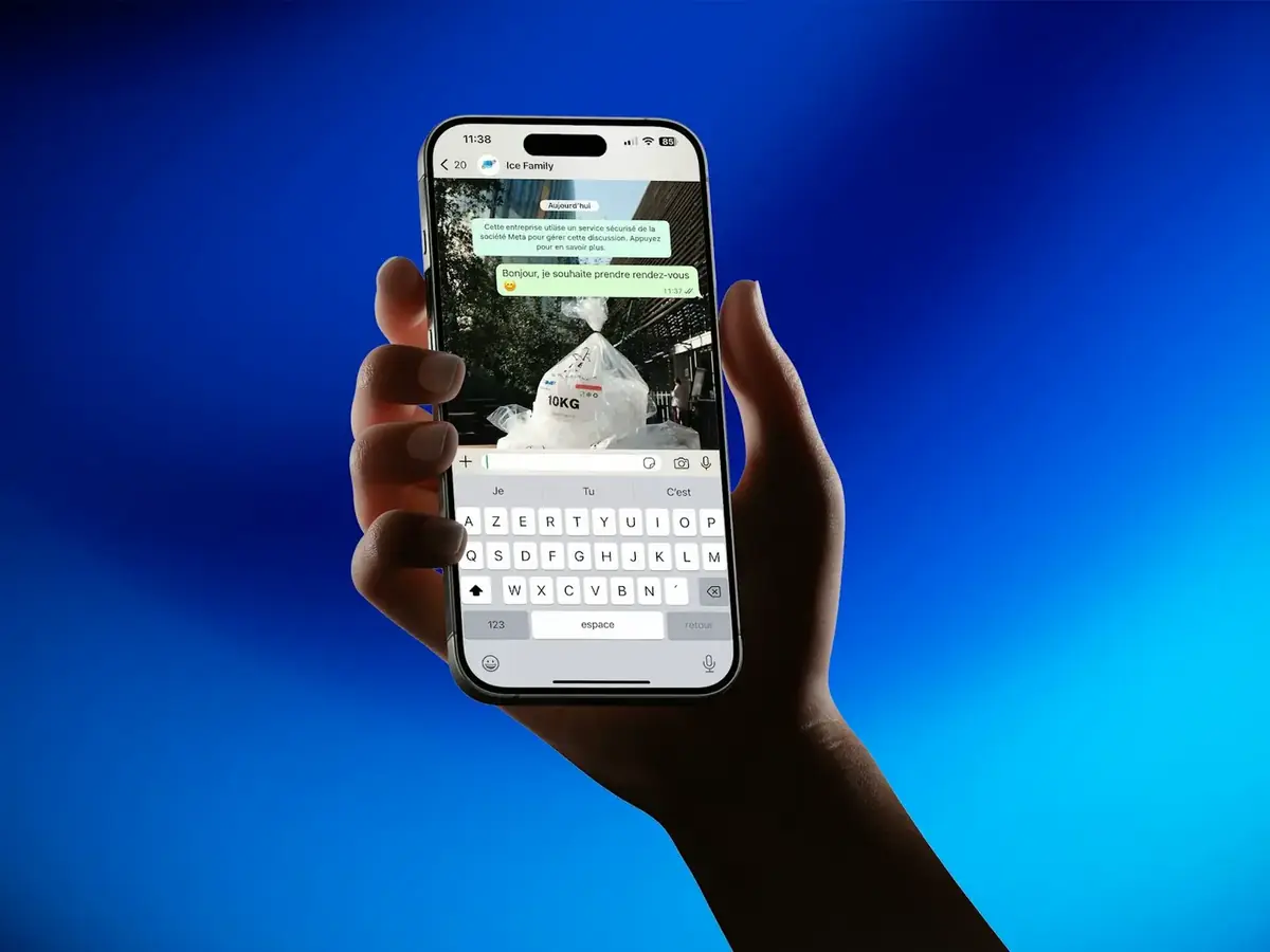 A hand holding a phone showing a message
